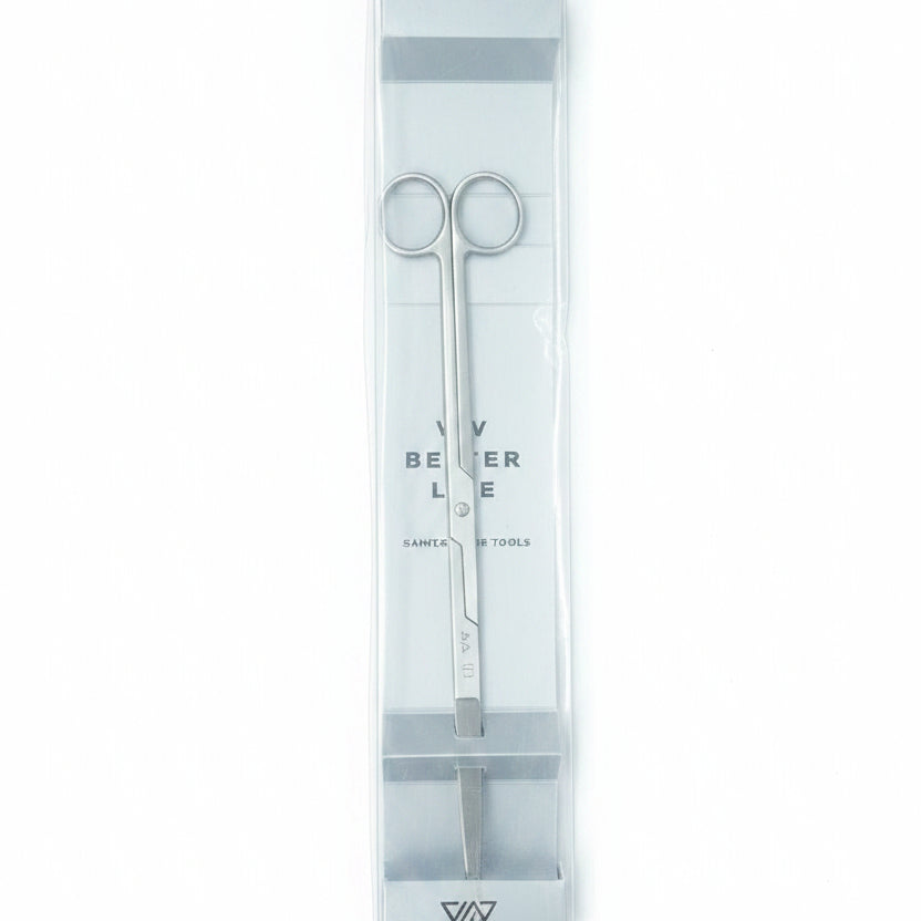 Set of tweezers in a clear plastic case on a wooden surface